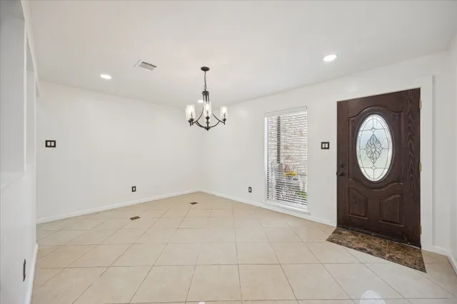 a view of an empty room with a fireplace