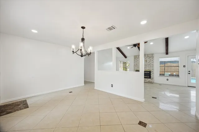 a view of a livingroom with a furniture and chandelier