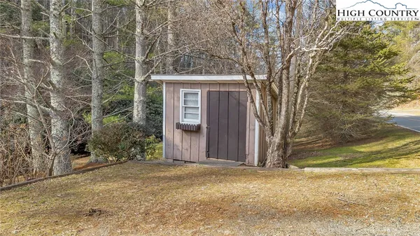 a view of a house with a tree