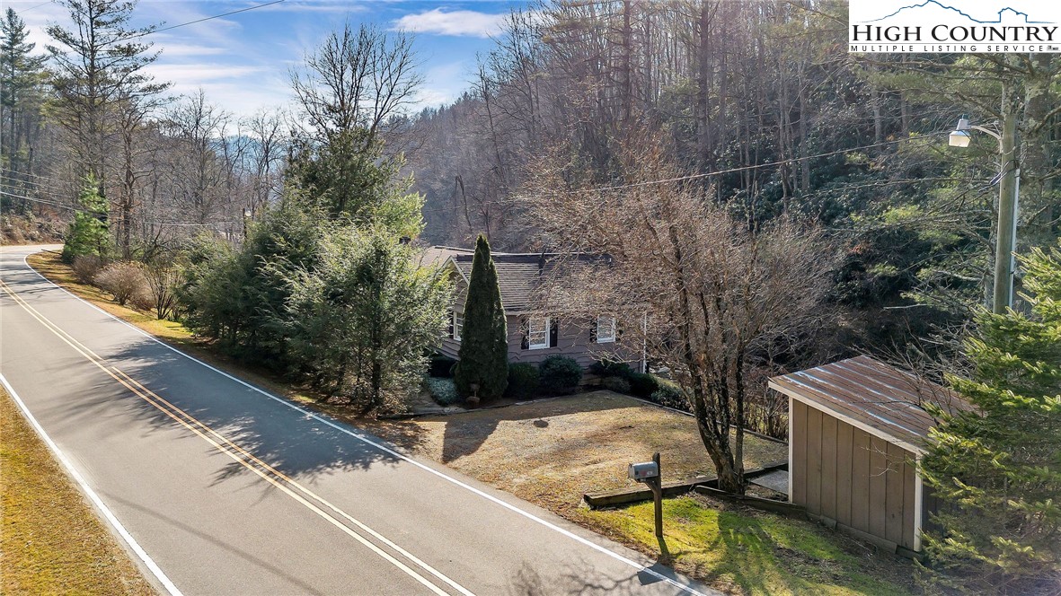 2862 Lower Nettle Knob Road West Jefferson, NC 28694 - Photo 16 of 41 a view of backyard with outdoor seating