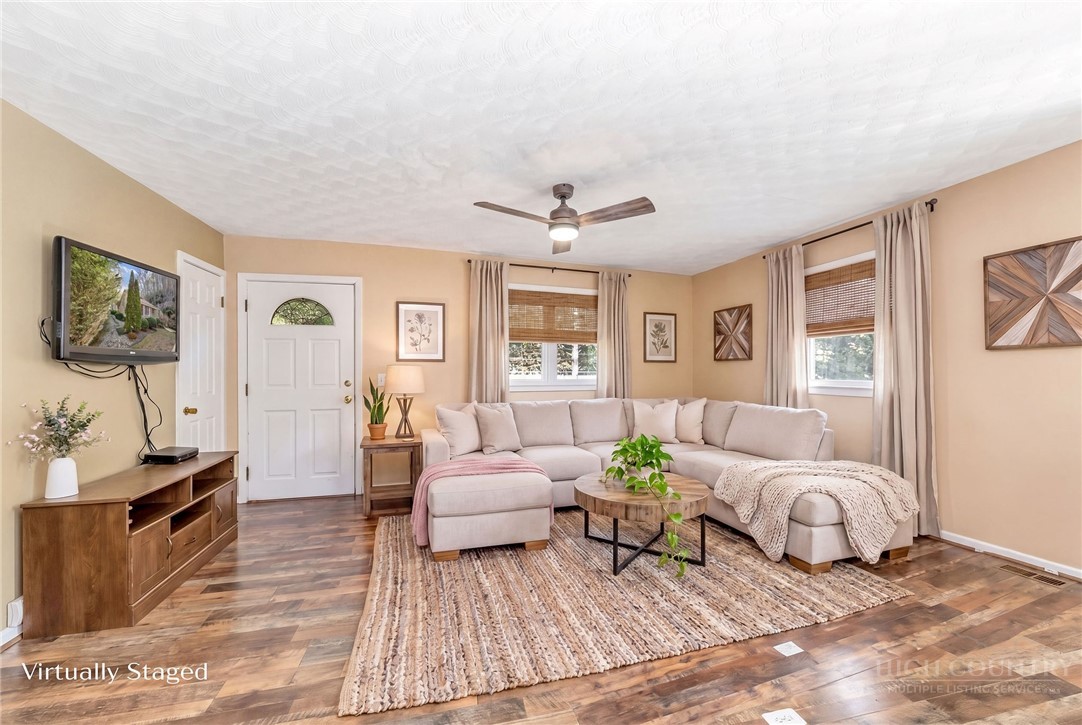 2862 Lower Nettle Knob Road West Jefferson, NC 28694 - Photo 17 of 48 a living room with furniture and wooden floor