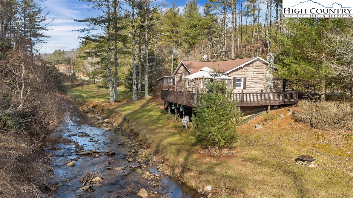 2862 Lower Nettle Knob Road West Jefferson, NC 28694 - Photo 4 of 41 a view of a house with a yard