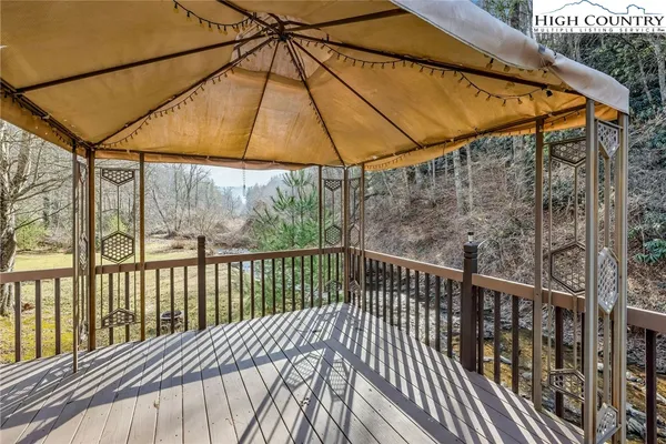a view of a two chairs on the deck