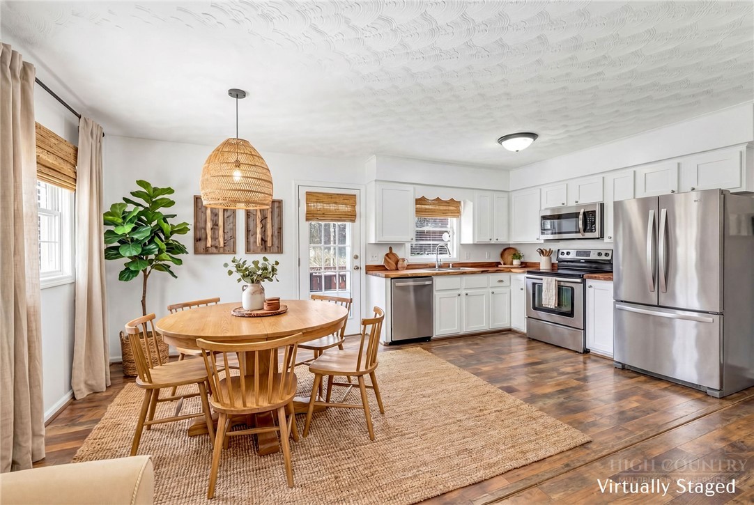 2862 Lower Nettle Knob Road West Jefferson, NC 28694 - Photo 47 of 48 a view of a kitchen with furniture and a window
