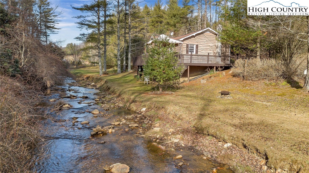 2862 Lower Nettle Knob Road West Jefferson, NC 28694 - Photo 7 of 41 a front view of a house with a yard