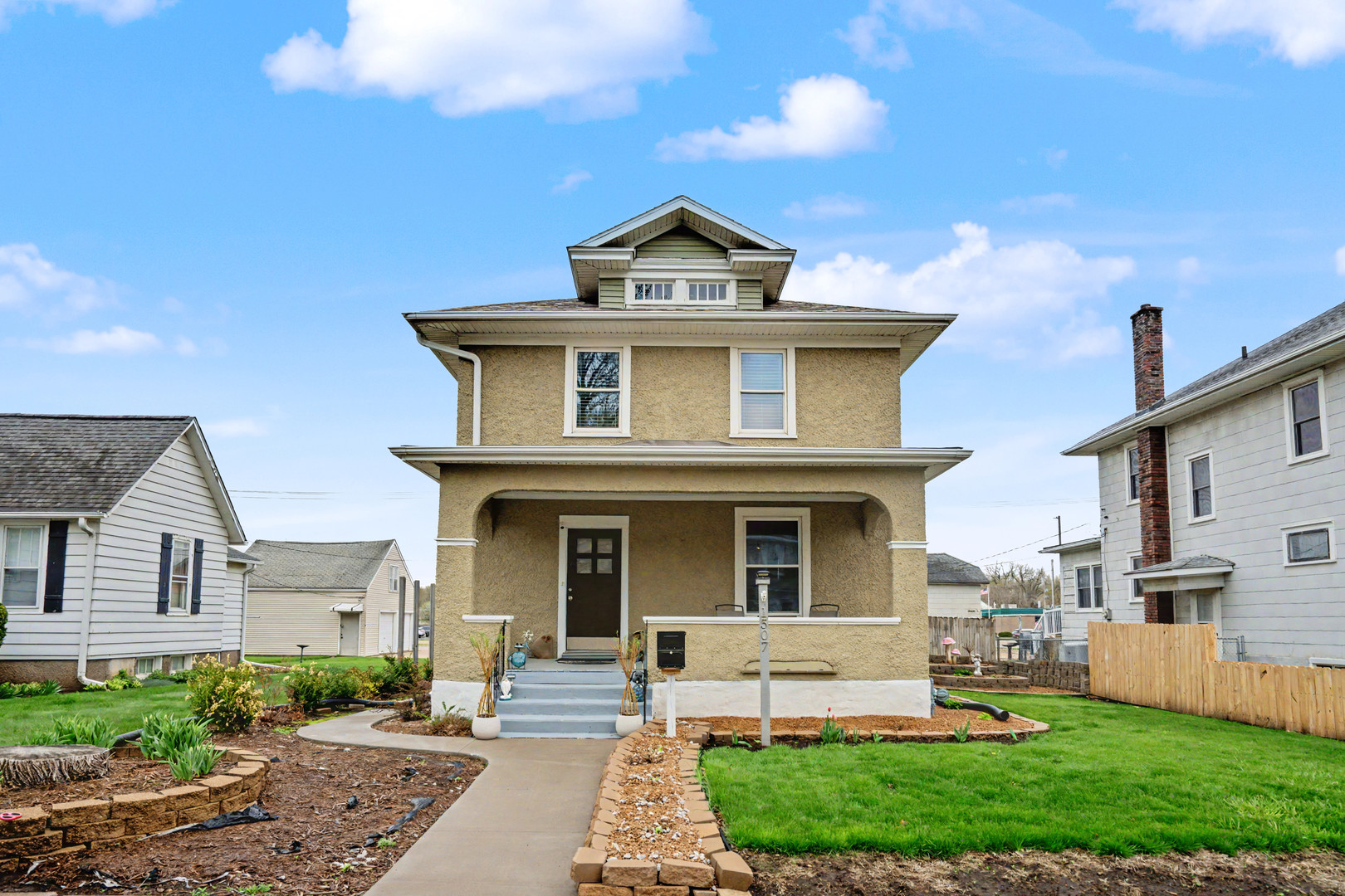 front view of a house with a yard