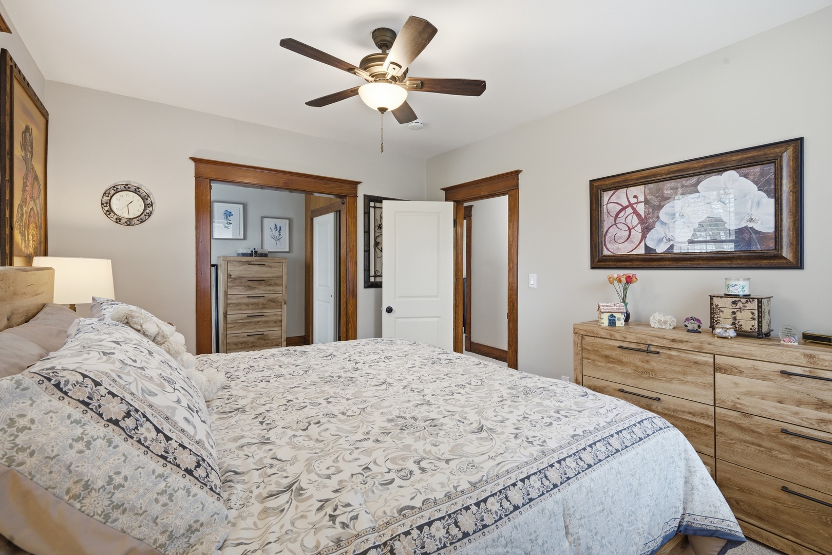 1507 Pershing Boulevard Clinton, IA 52732 - Photo 13 of 29 a bedroom with a large bed a chandelier and closet