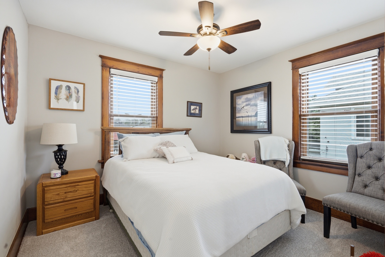 1507 Pershing Boulevard Clinton, IA 52732 - Photo 18 of 29 a bedroom with a bed a chandelier and a couch