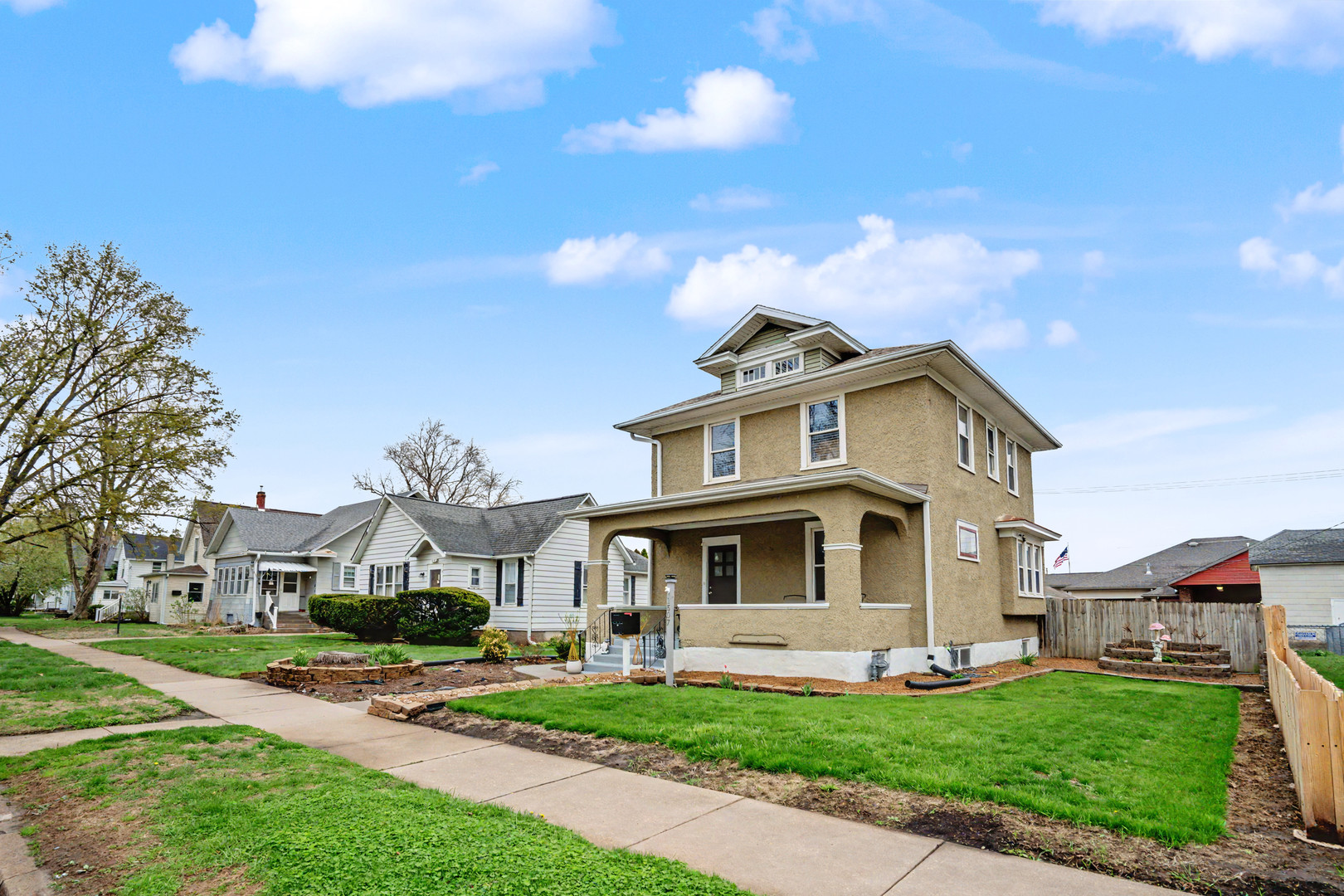 1507 Pershing Boulevard Clinton, IA 52732 - Photo 2 of 29 a view of a white house with a big yard and large trees