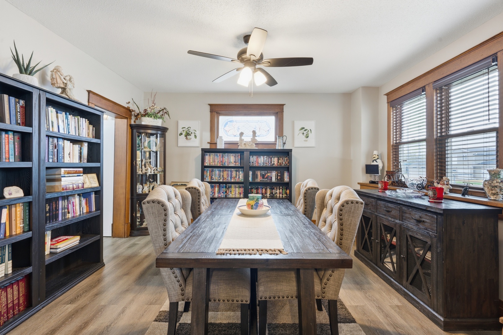1507 Pershing Boulevard Clinton, IA 52732 - Photo 6 of 29 a view of a dining room with furniture and a book shelf