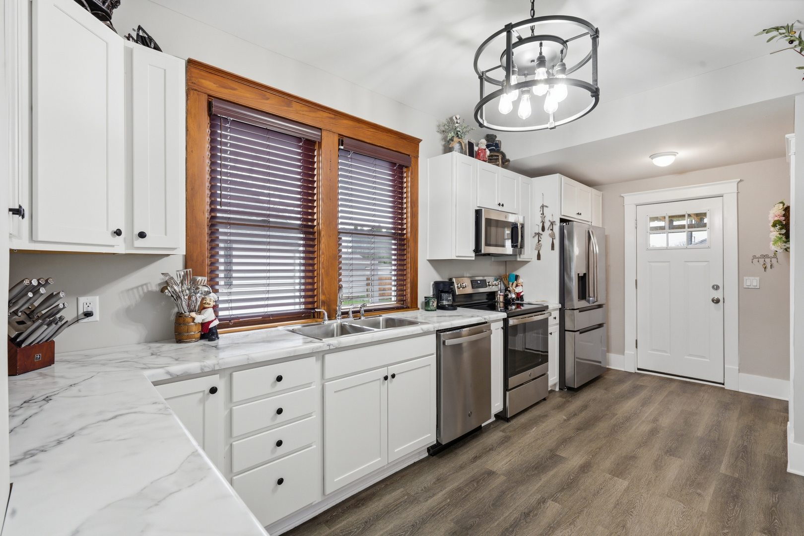 1507 Pershing Boulevard Clinton, IA 52732 - Photo 8 of 29 a kitchen with stainless steel appliances granite countertop a stove and cabinets