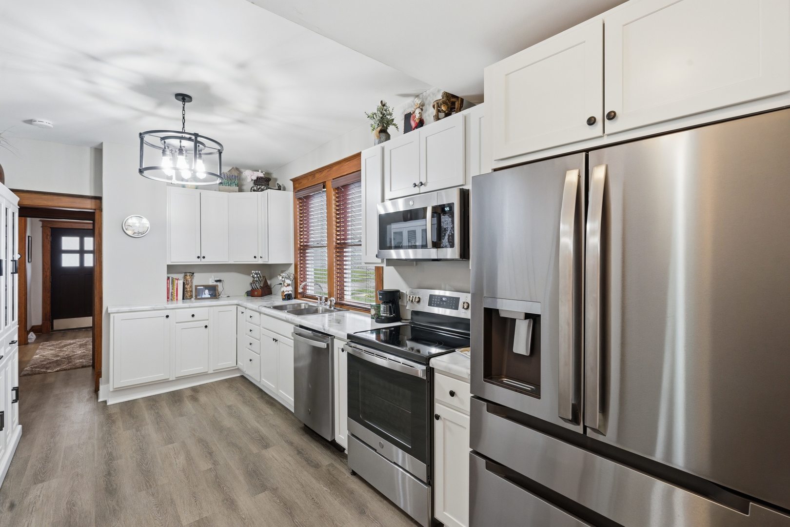 1507 Pershing Boulevard Clinton, IA 52732 - Photo 9 of 29 a kitchen with stainless steel appliances a refrigerator sink and cabinets