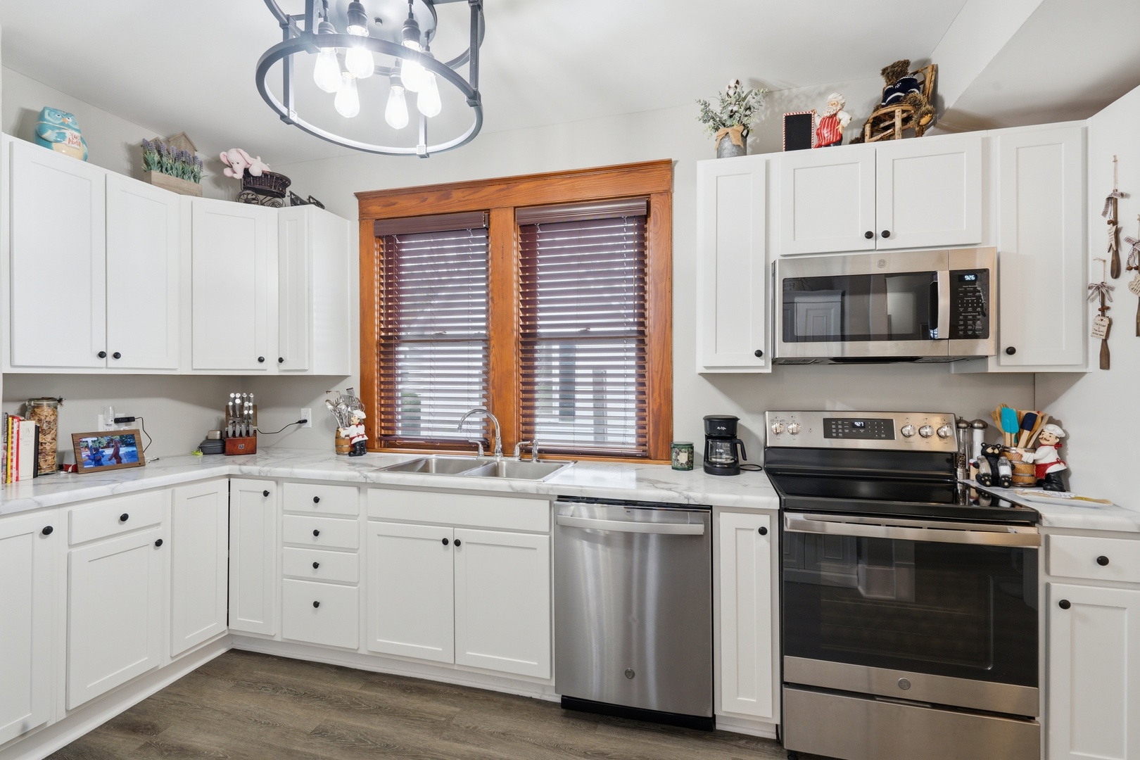 1507 Pershing Boulevard Clinton, IA 52732 - Photo 10 of 29 a kitchen with cabinets appliances a sink and a window