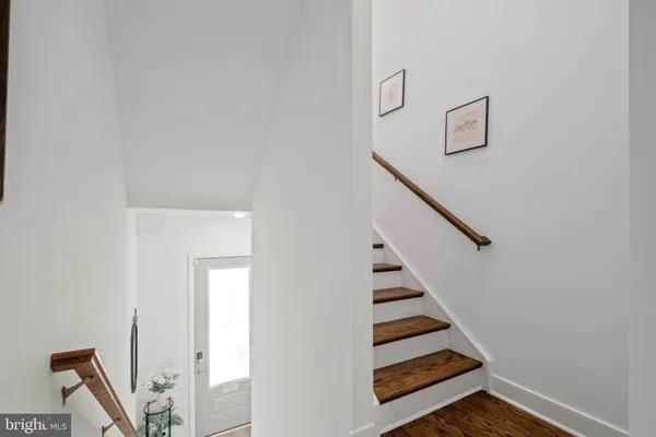 a view of entryway with wooden floor