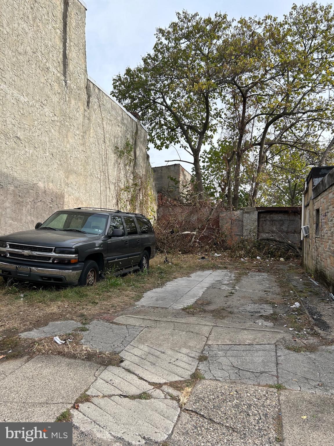 2345 North 25th Street Philadelphia, PA 19132 - Photo 3 of 8 a car parked in front of a brick house