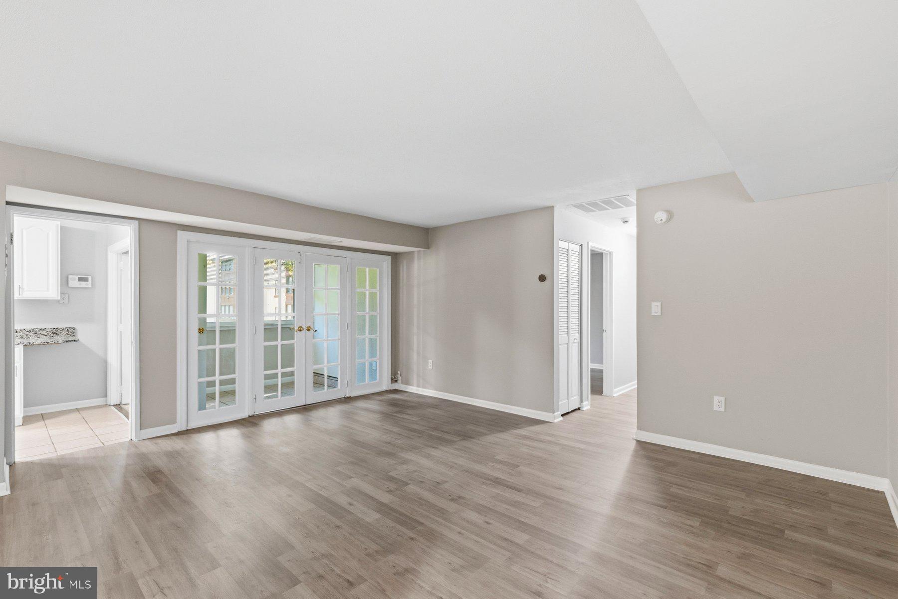 5866 Thunder Hill Road, Unit A4 Columbia, MD 21045 - Photo 6 of 21 Spacious living room with hardwood floors