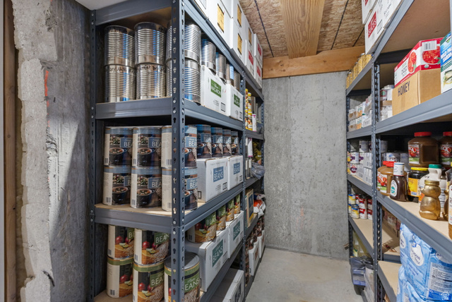 882 Sego Lily Way Mapleton, UT 84664 - Photo 29 of 41 Basement storage area featuring concrete walls and ceiling with exposed wood joists