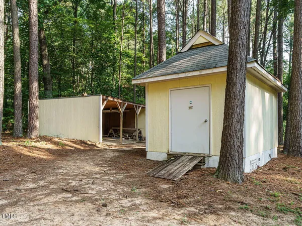 a view of house with trees in the background