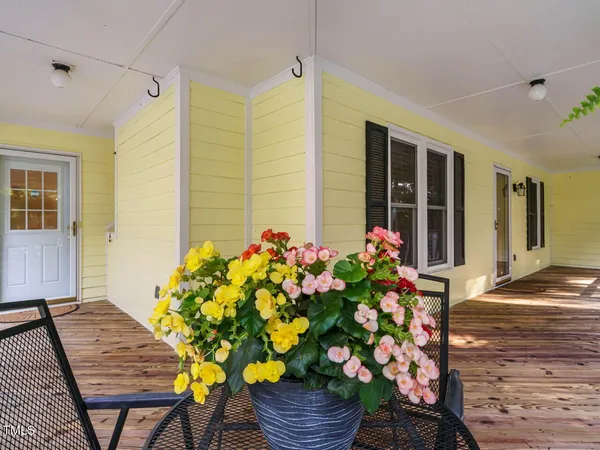 a front view of a house with wooden floor