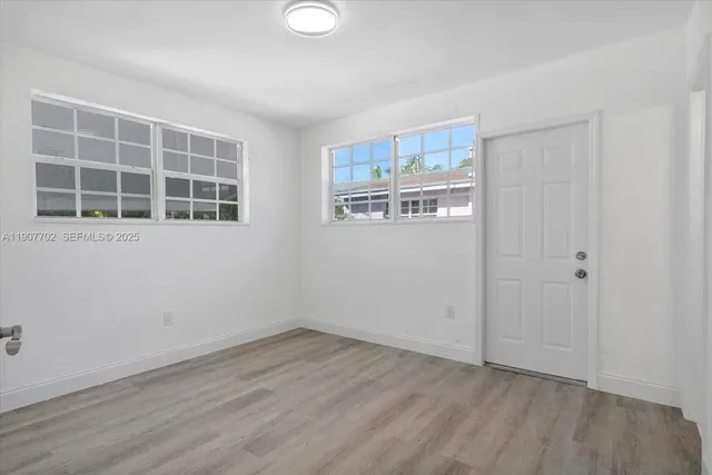a view of an empty room with a window