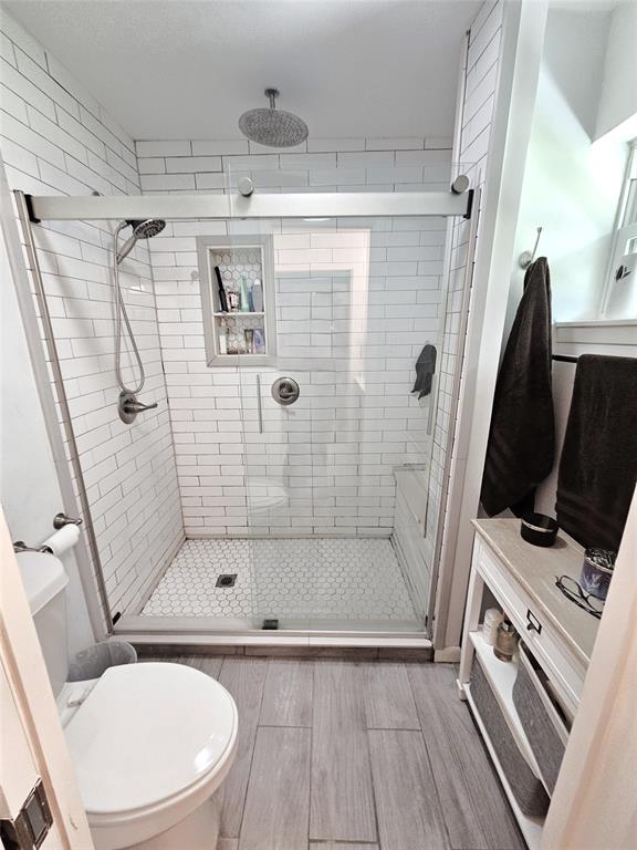 220 North Calhoun Street Groesbeck, TX 76642 - Photo 12 of 24 a bathroom with a shower a toilet and a sink