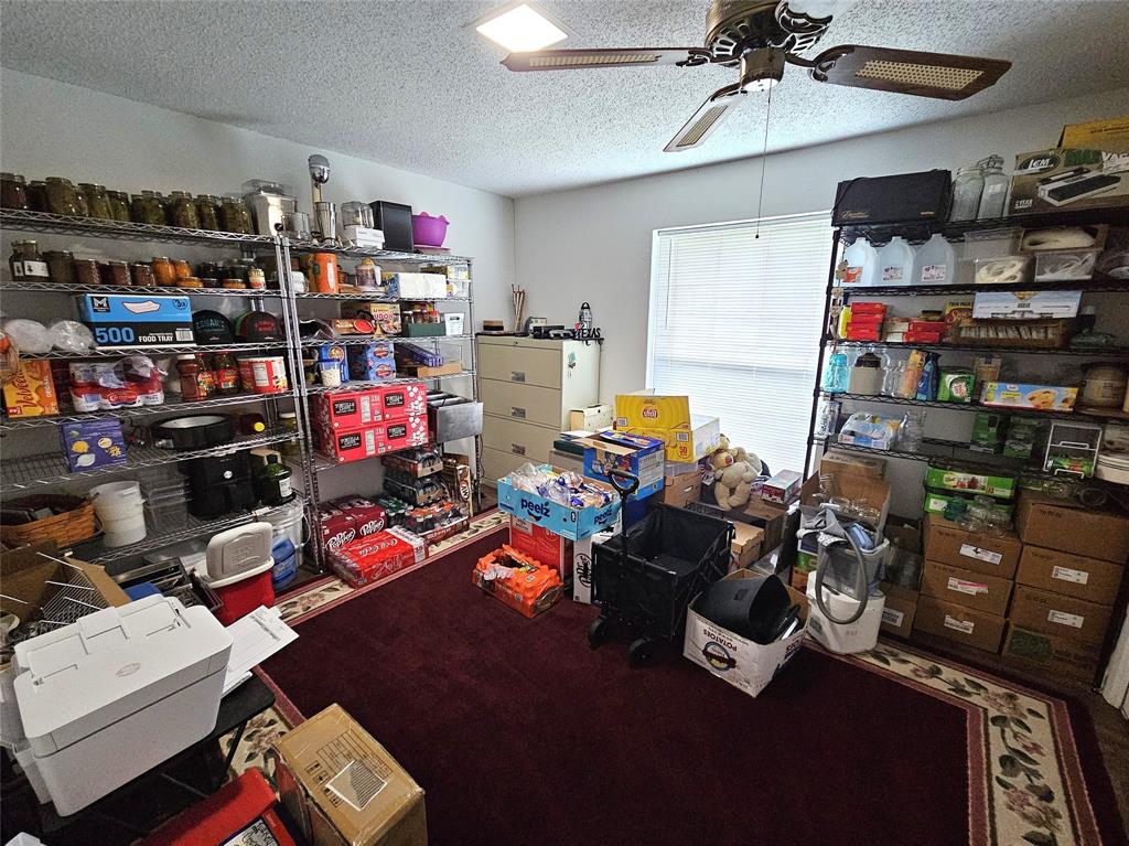 220 North Calhoun Street Groesbeck, TX 76642 - Photo 15 of 24 a room with storage and utility