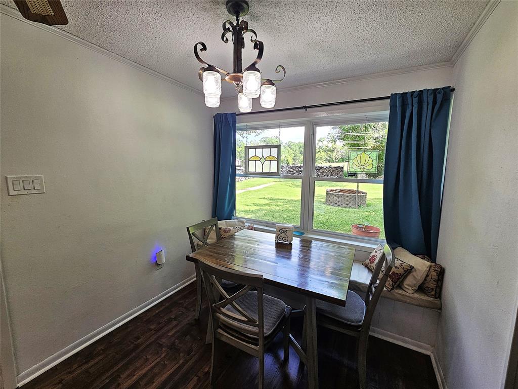 220 North Calhoun Street Groesbeck, TX 76642 - Photo 8 of 24 a view of a dining room with furniture window and outside view