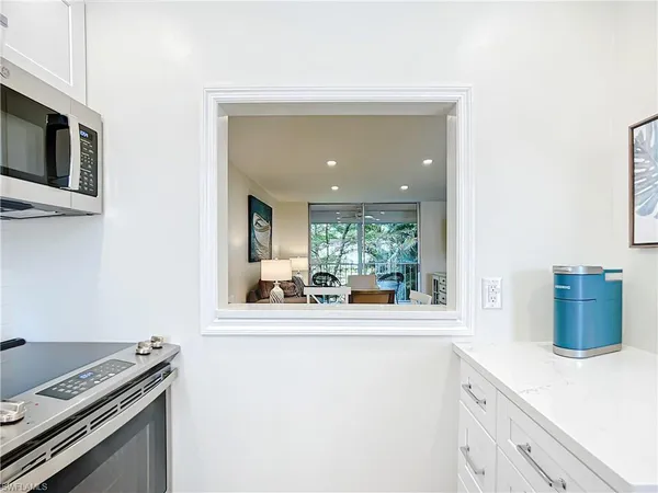 a kitchen with a stove and a microwave