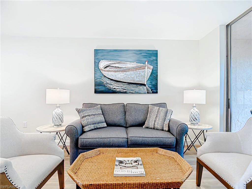 180 Turtle Lake Court, Unit 206 Naples, FL 34105 - Photo 23 of 50 a view of a couch in a living room