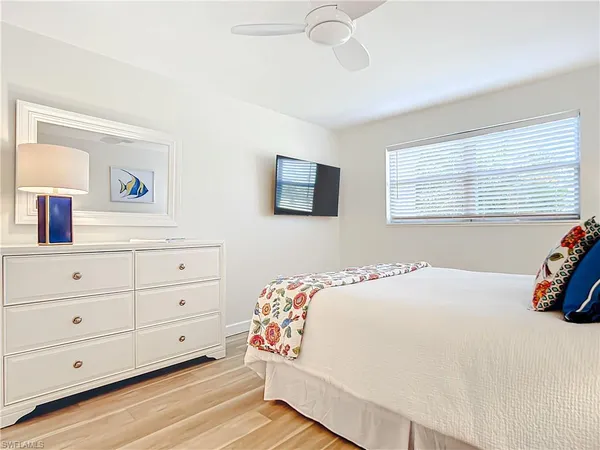 a bedroom with a bed and a dresser