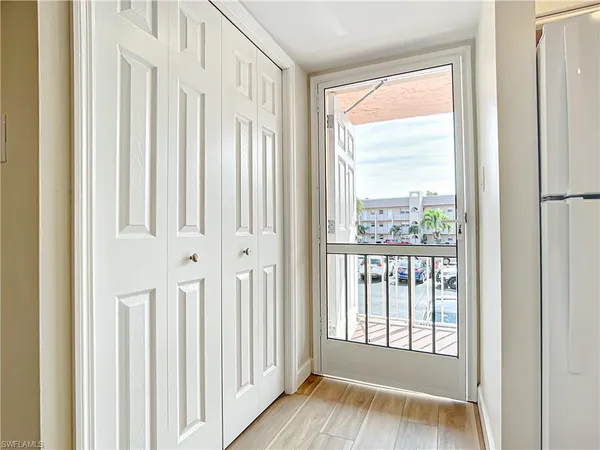 a view of front door with a wooden floor