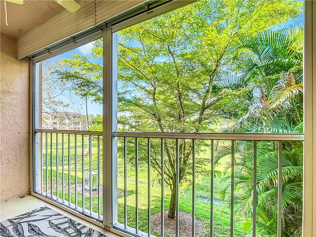 180 Turtle Lake Court, Unit 206 Naples, FL 34105 - Photo 42 of 50 a view of a balcony with lake view