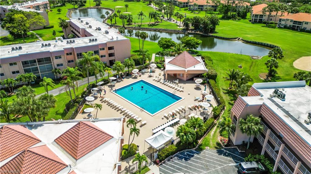 180 Turtle Lake Court, Unit 206 Naples, FL 34105 - Photo 47 of 50 an aerial view of a house with a garden