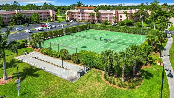 a view of yard with swimming pool and green space