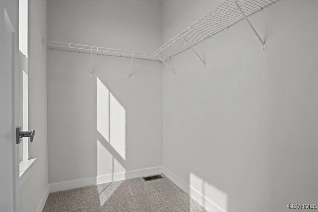 a bathroom with a double vanity sink mirror and shower