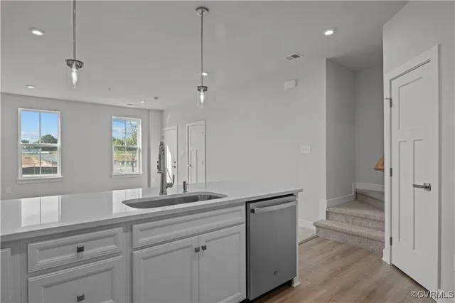 a view of a hallway and a hallway with a livingroom