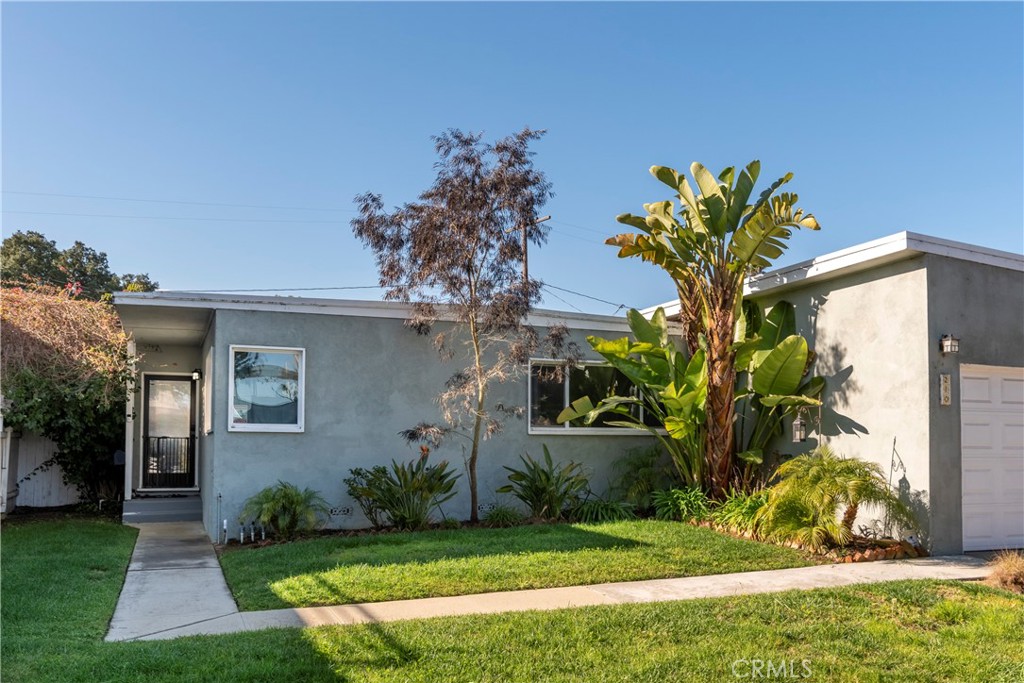 210 Vía Alameda Redondo Beach, CA 90277 - Photo 3 of 19 a front view of a house with a yard and potted plants