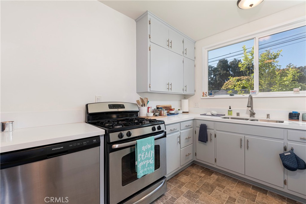 210 Vía Alameda Redondo Beach, CA 90277 - Photo 7 of 19 a kitchen with a stove a sink and a window