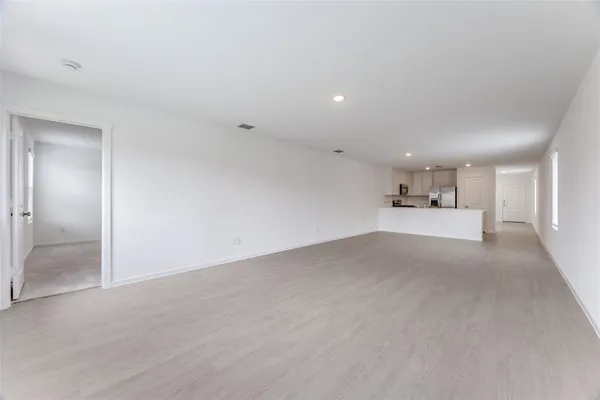 a kitchen with cabinets stainless steel appliances and a counter top space