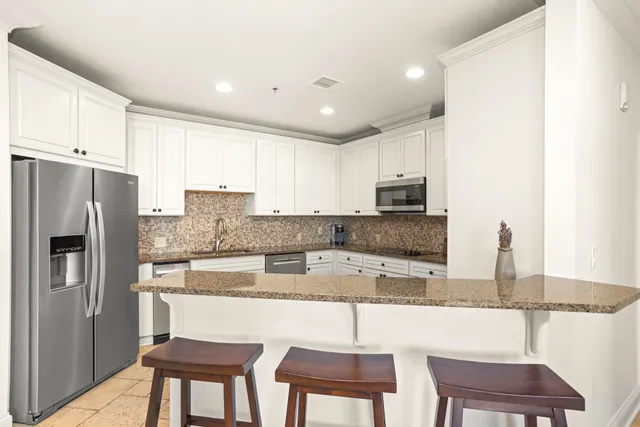 a bathroom with a granite countertop sink tub and a mirror