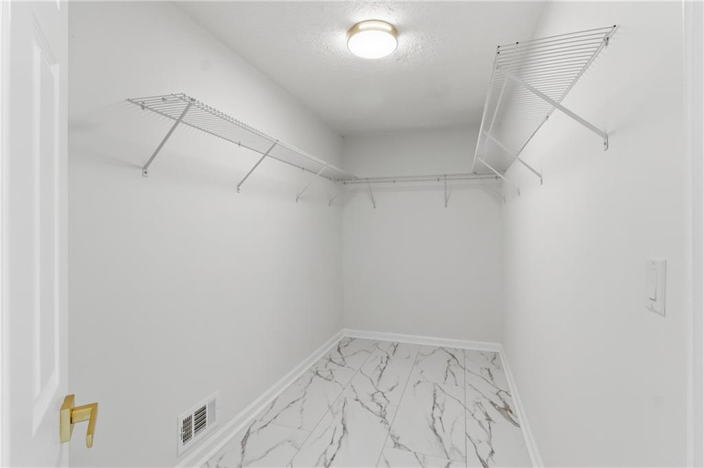 3760 Mountain Cove Road Snellville, GA 30039 - Photo 12 of 73 a view of a room with racks on the wall