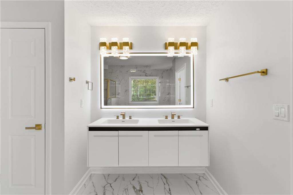 3760 Mountain Cove Road Snellville, GA 30039 - Photo 13 of 73 a bathroom with a sink and a mirror