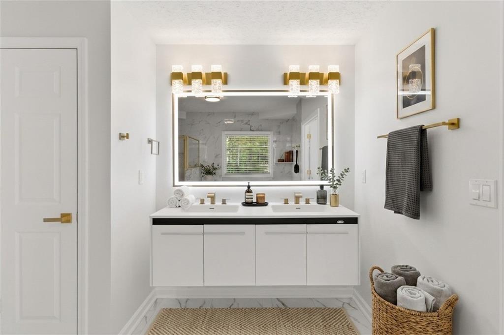 3760 Mountain Cove Road Snellville, GA 30039 - Photo 14 of 73 a bathroom with a sink and a mirror