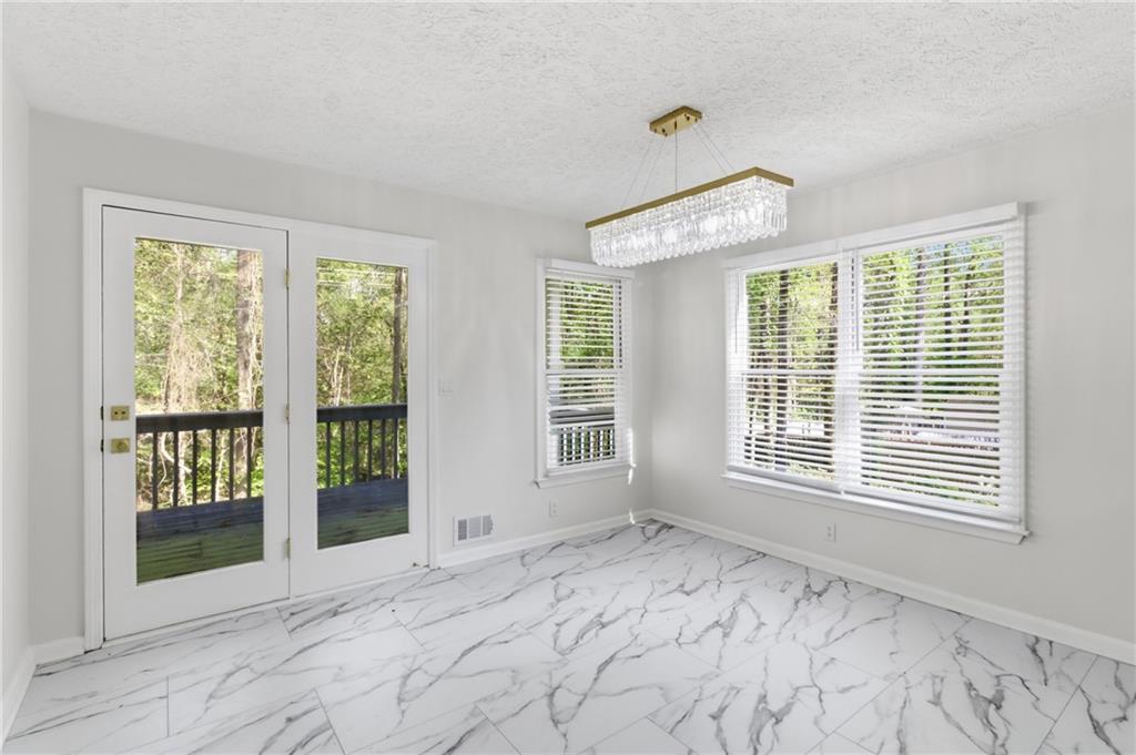 3760 Mountain Cove Road Snellville, GA 30039 - Photo 32 of 73 a view of an empty room with a window