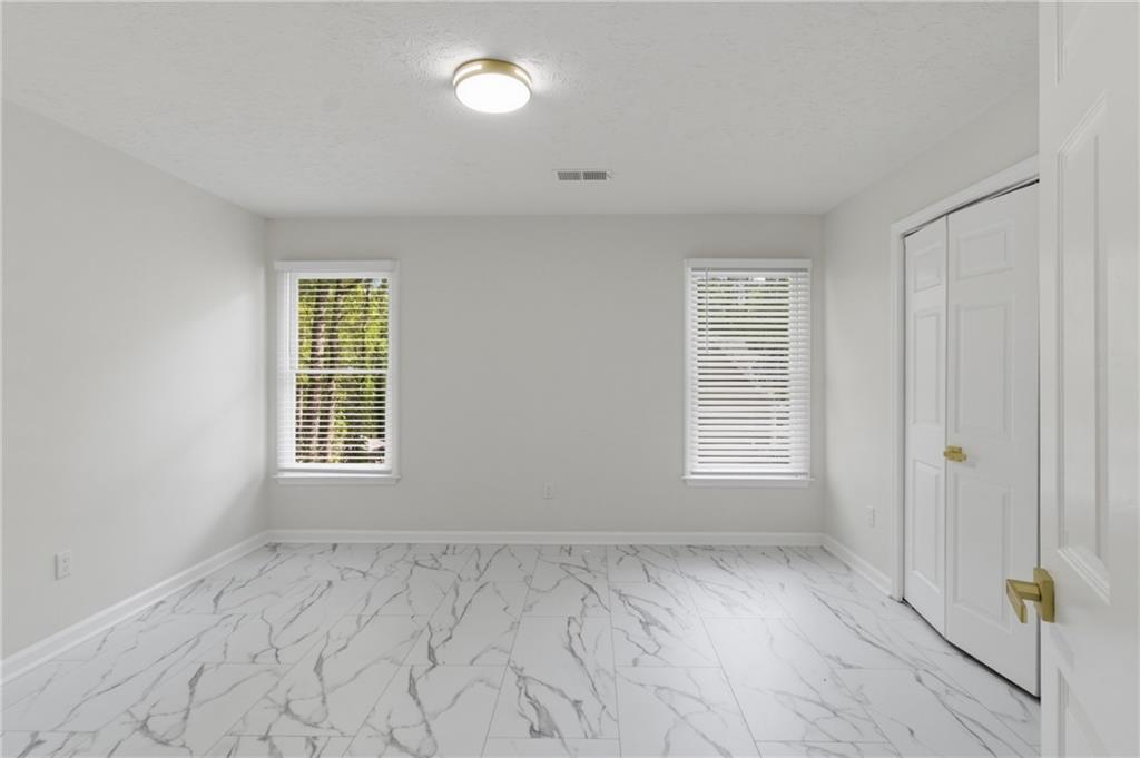 3760 Mountain Cove Road Snellville, GA 30039 - Photo 42 of 73 a view of an empty room with a window