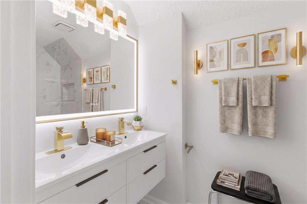 3760 Mountain Cove Road Snellville, GA 30039 - Photo 45 of 73 a bathroom with a sink mirror and vanity