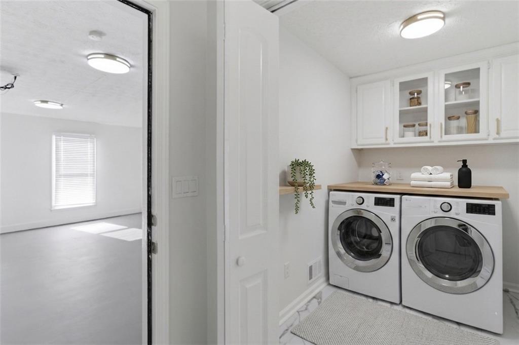 3760 Mountain Cove Road Snellville, GA 30039 - Photo 52 of 73 a view of a hallway with washer and dryer