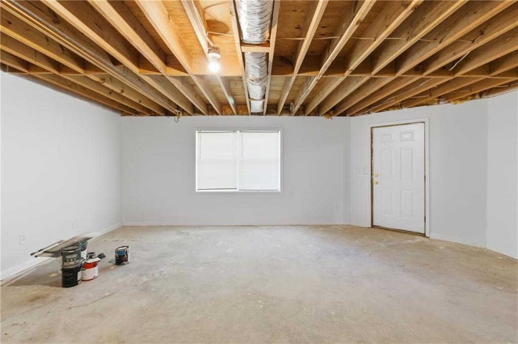 3760 Mountain Cove Road Snellville, GA 30039 - Photo 59 of 73 a view of empty room with wooden ceiling fan