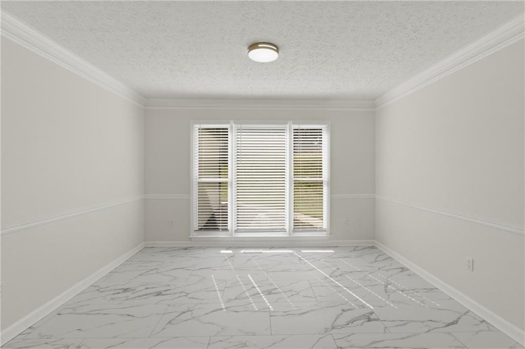 3760 Mountain Cove Road Snellville, GA 30039 - Photo 6 of 73 an empty room with windows