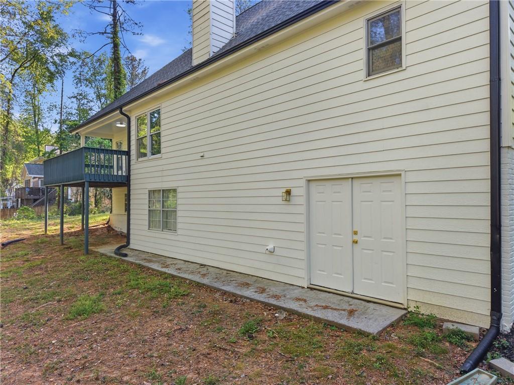 3760 Mountain Cove Road Snellville, GA 30039 - Photo 68 of 73 a view of a house with a backyard